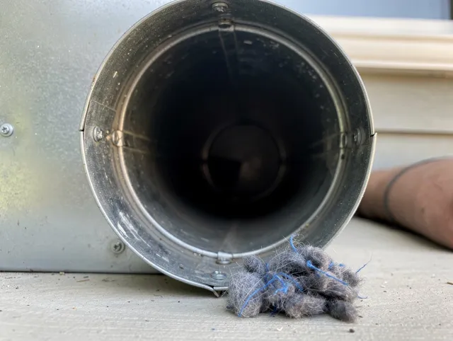 Harrisburg Dryer Vent Cleaning technician using specialized equipment to clear severe dryer vent blockage in Harrisburg